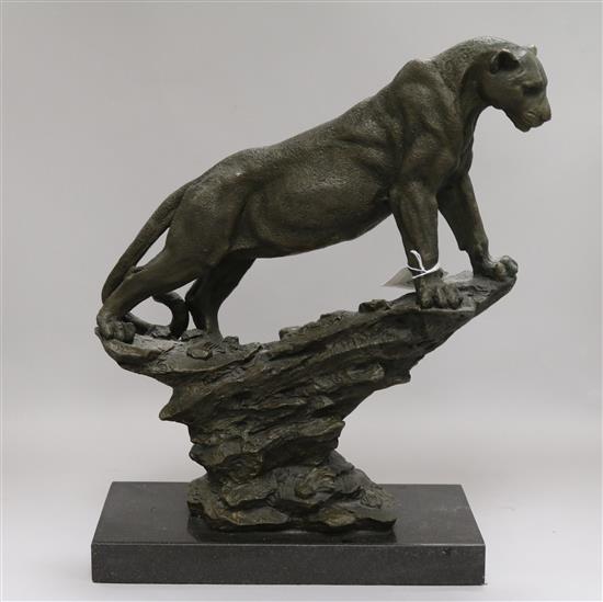 A bronze model of a mountain lion signed Pougatti by Talos Gallery on marble base height 39cm width 28.5cm